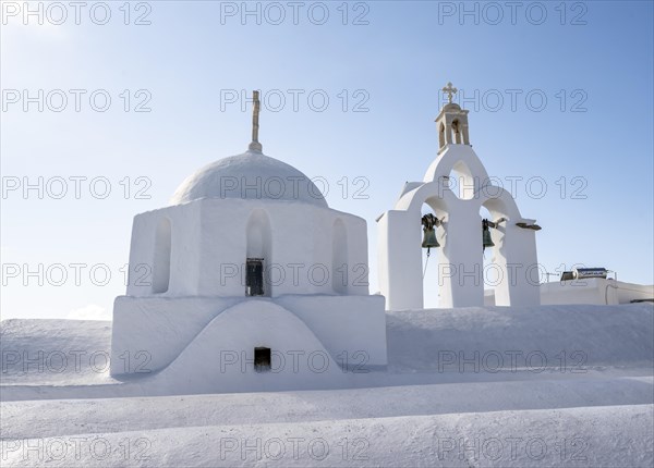 Dome and bell tower with white Greek Orthodox church