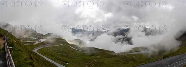 Morning fog drifts over a mountain ridge