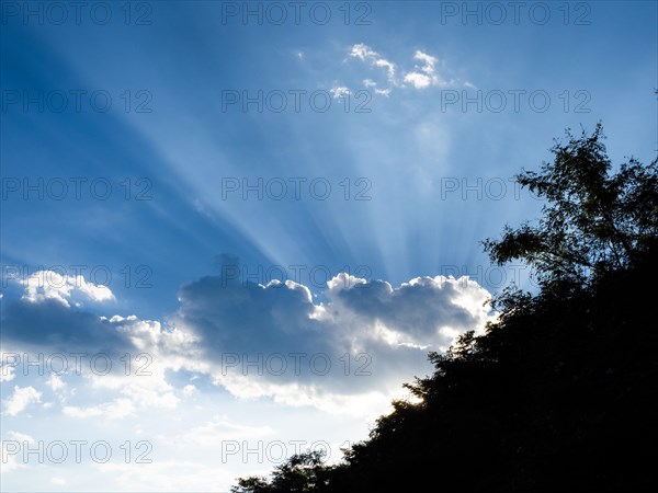 Rays of sunshine breaking through clouds