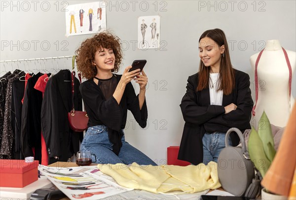 Clothes designers working store