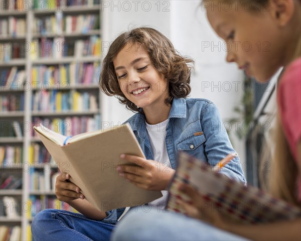 Kids reading doing their homework