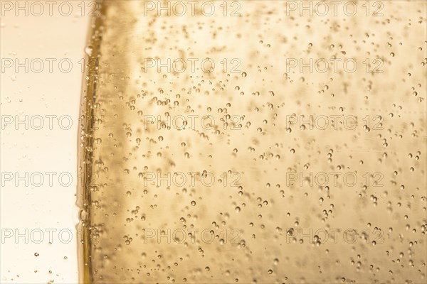 Side view glass with champagne bubbles