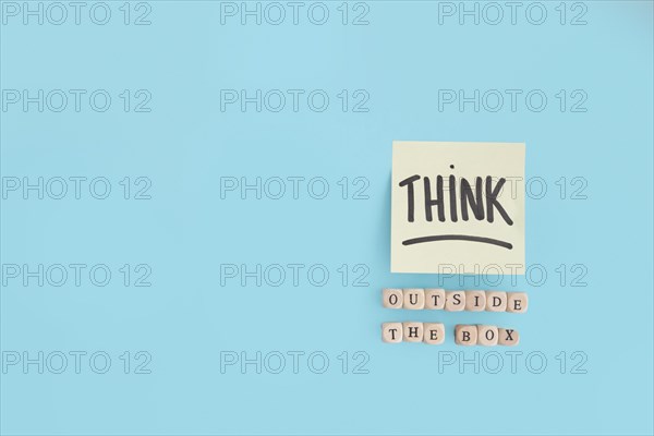 Outside box text made with wooden blocks think text adhesive note