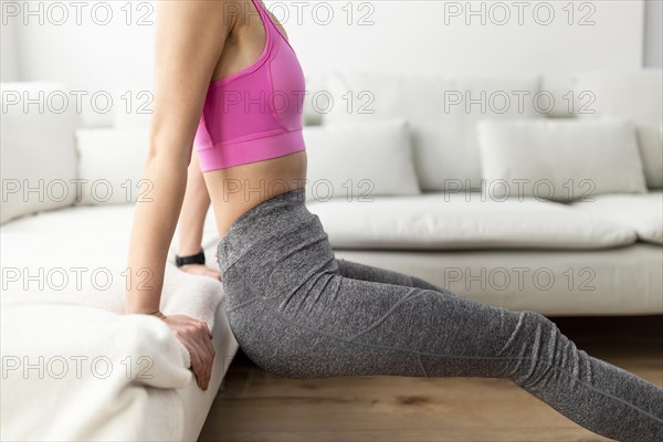 Close up woman training living room