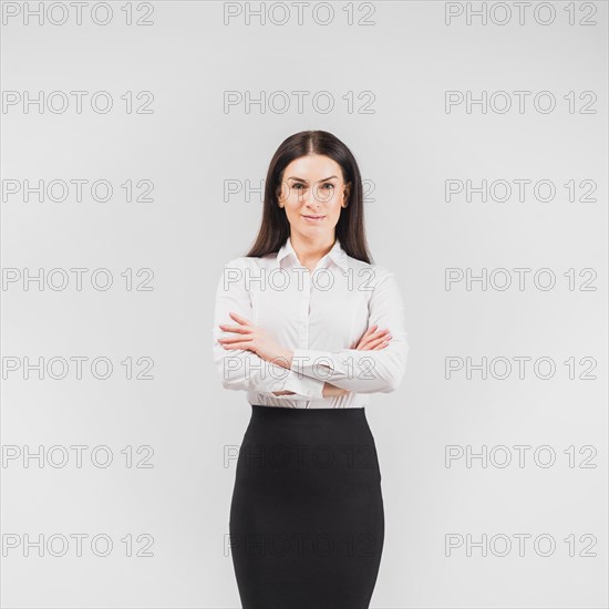 Business woman standing with crossed arms
