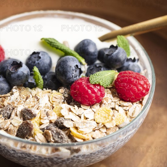 Close up oatmeal bowl with raspberries blueberries