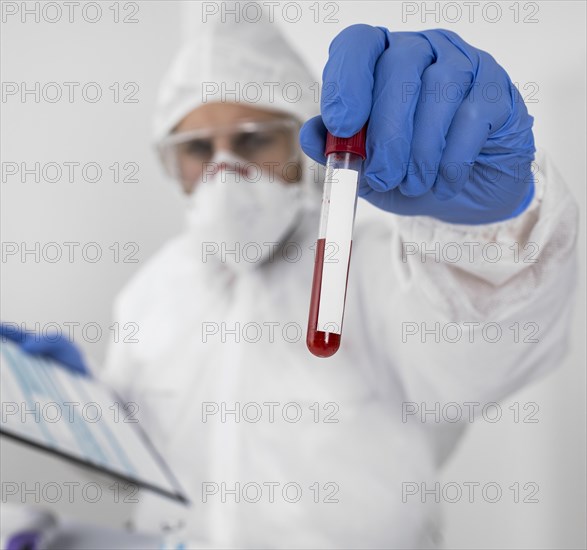 Doctor holding covid sample