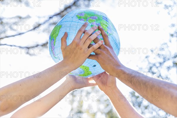 Hands holding inflatable globe