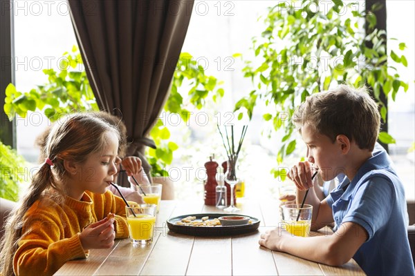 Kids drinking juice