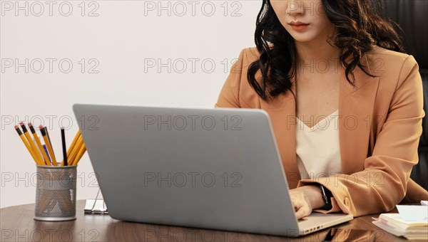 Close up woman working laptop