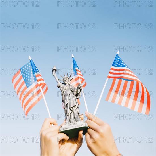 Hands waving american flags