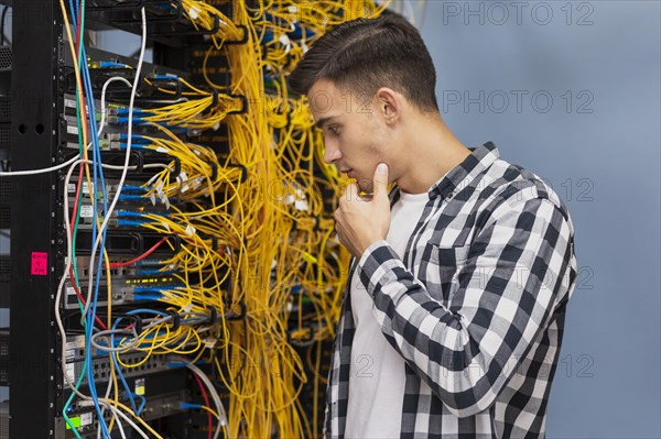Young network engineer server room medium shot