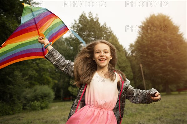 Front view beautiful happy girl with kite