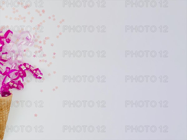 Pink confetti ice cream cone with copy space