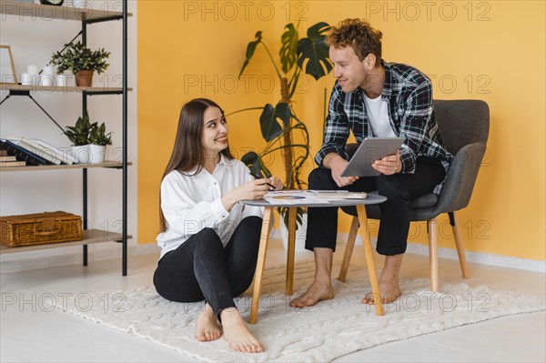 Couple making plans together redecorate house