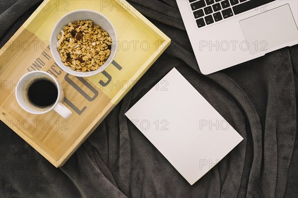 Booklet mockup with coffee wooden board laptop