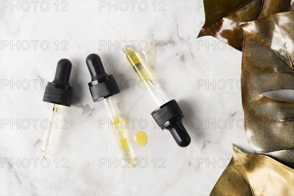 Flat lay different pipettes marble background