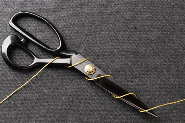 Scissors with thread top view