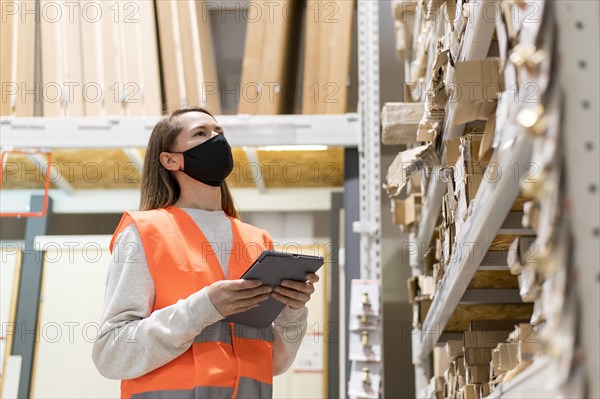 Medium shot woman wearing mask job