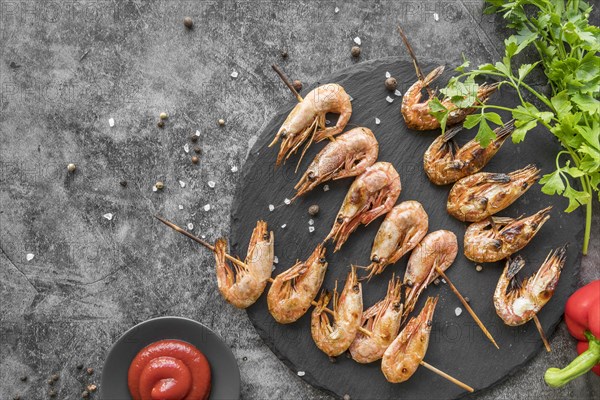 Top view shrimp skewers with sauce