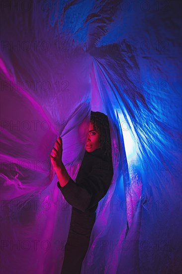 Sideways woman with plastic foil