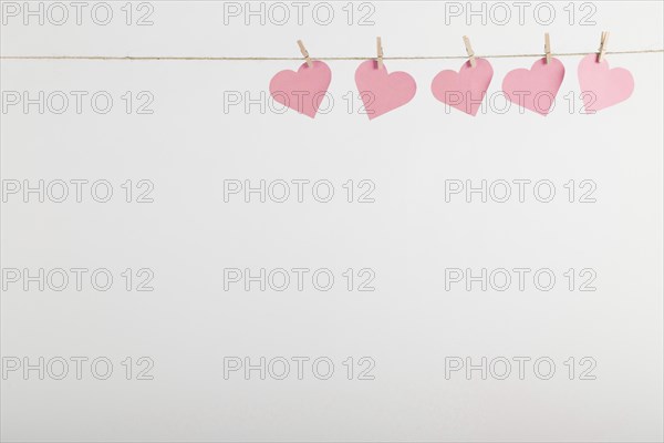 Pink paper hearts hanging rope