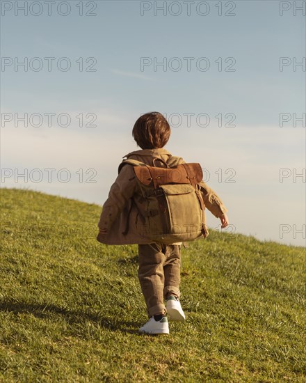Full shot kid with backpack