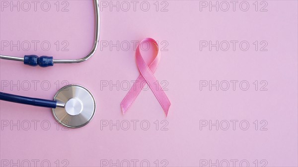 Top view pink ribbon with stethoscope