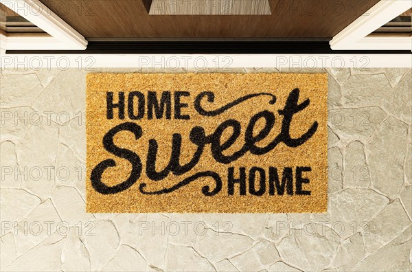 Home sweet home doormat on the porch at the front door