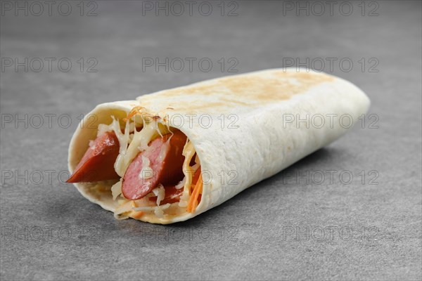 Flatbread rolled with with thin sausage