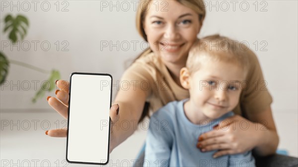 Close up woman holding smartphone