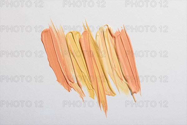 Flat lay yellow paint brush strokes