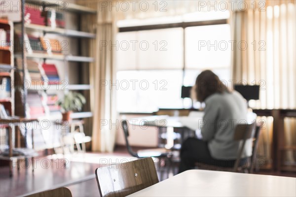 Furniture library with working person