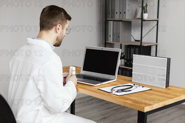 Medium shot doctor desk