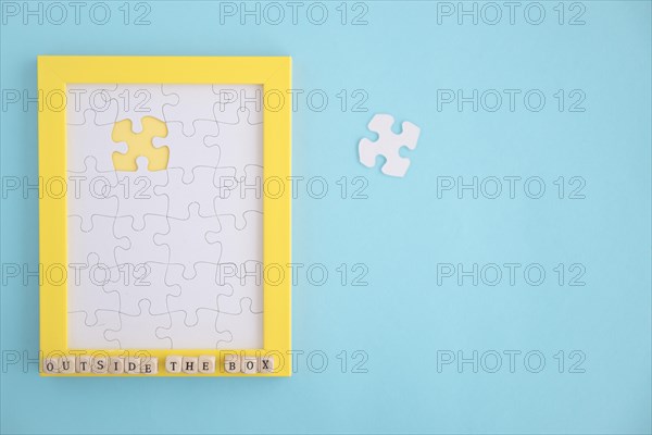 Missing white jigsaw puzzle frame blue background