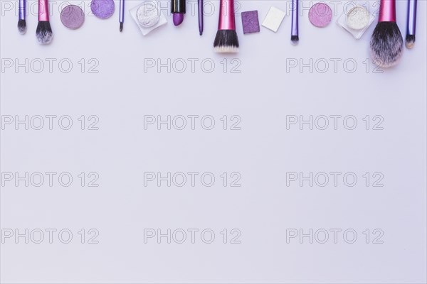 Top border arranged with cosmetics product white background