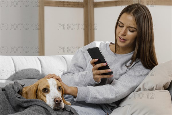 Medium shot girl with phone dog