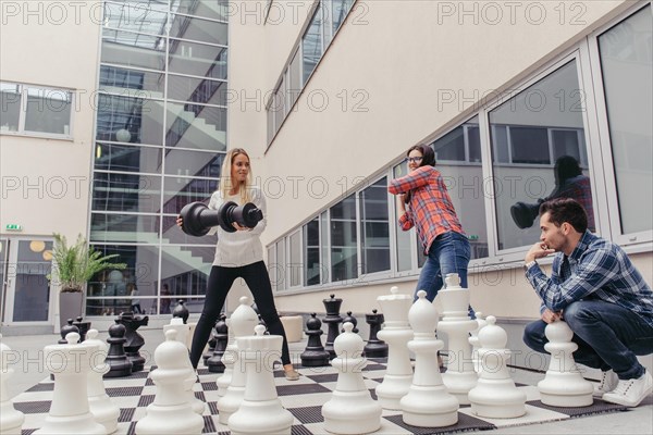 People having fun with chess