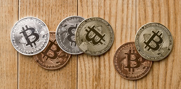 Bunch bitcoins wooden table