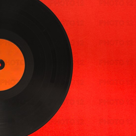 Close up vinyl record red background