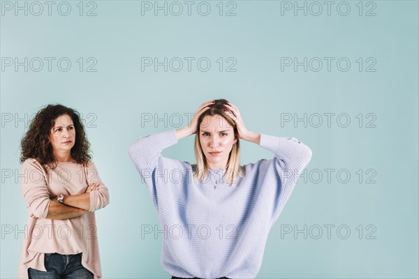 Displeased woman arguing with mom