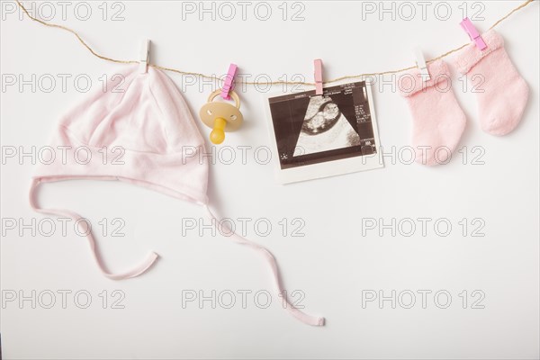 Sonography headwear pacifier sock hanging clothesline white backdrop
