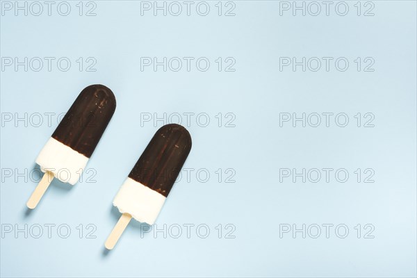 Pair ice cream half chocolate sticks