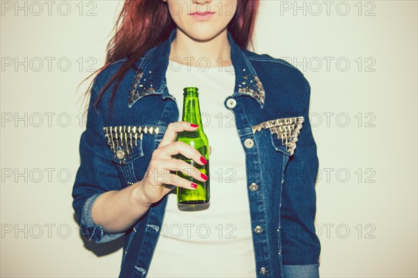 Young woman posing with beer