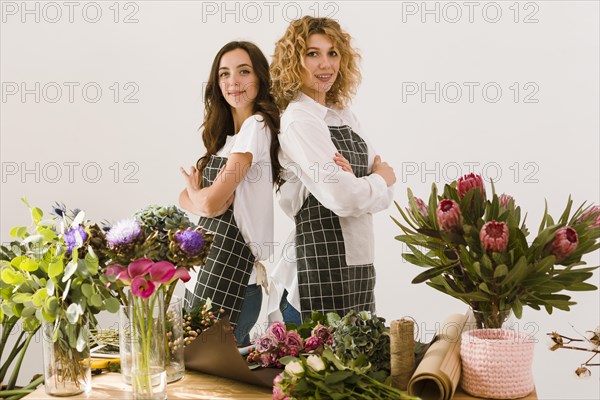 Medium shot florists posing together