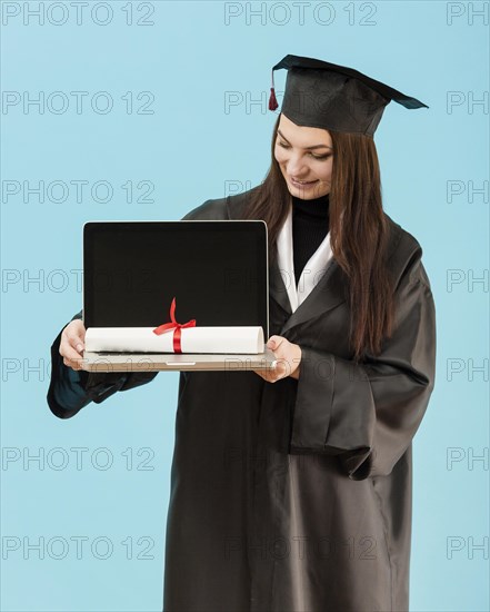 Medium shot girl holding laptop