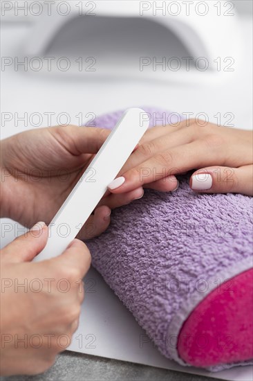 Woman having her manicure done