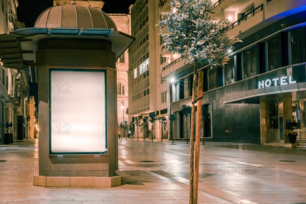 Illuminated billboard near street