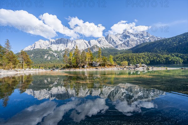 Zugspitze massif and Zugspitze reflected in Eibsee lake