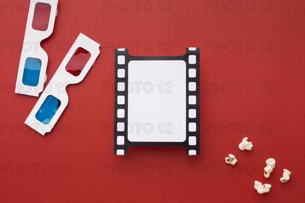 Top view arrangement movie elements red background